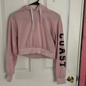 baby pink colored cropped hoodie